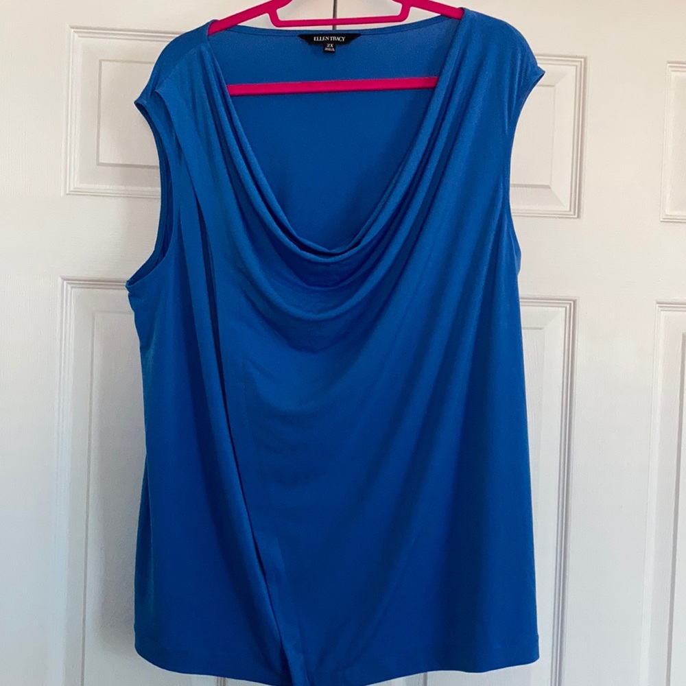 Blue sleeveless top.